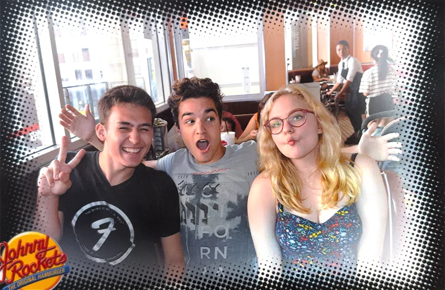 Three friends making faces in a comic-dot frame