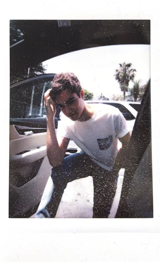 A polaroid of me in a car