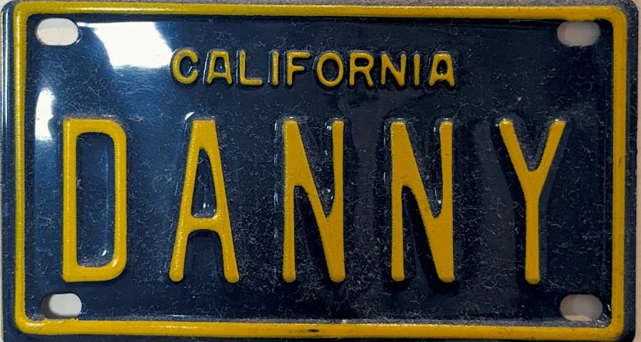 A mini California license plate reading DANNY